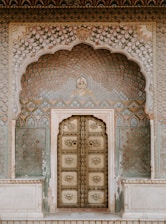 brown ornate wooden door