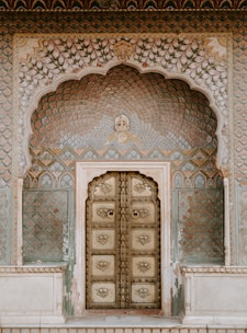 brown ornate wooden door