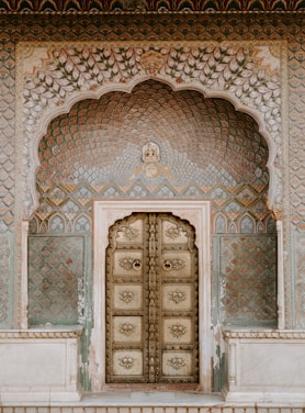 brown ornate wooden door