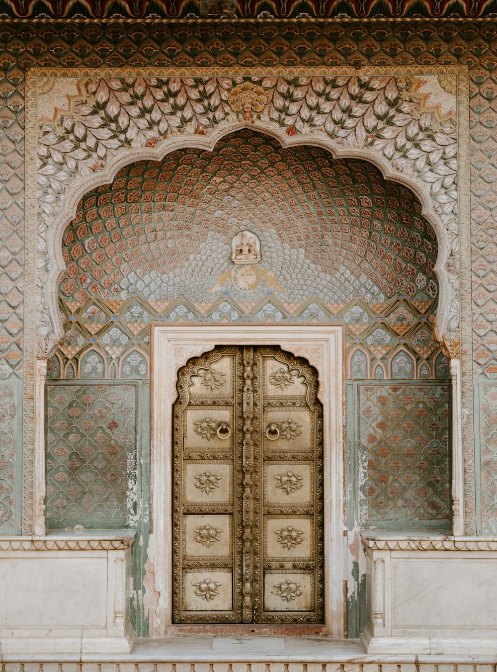 brown ornate wooden door