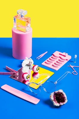 Artistic flat lay of various pleasure and wellness items with intense color contrasts.