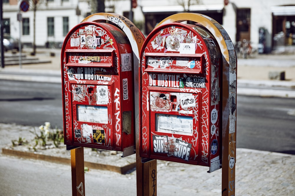 two mailboxes on street during daytime