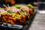 selective focus photography of grilled beef tops with vegetables