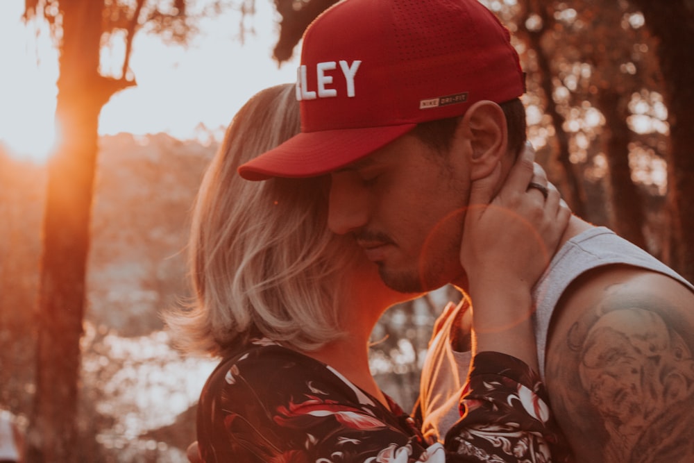 closeup photo of man and woman hugging each other