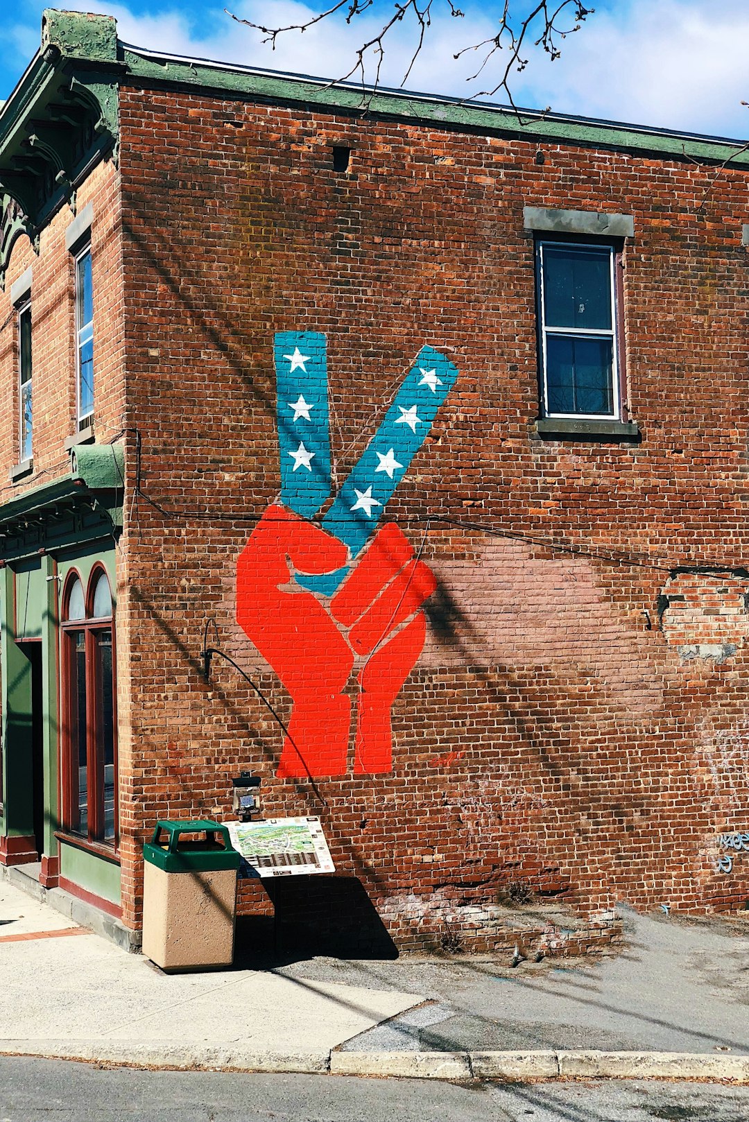 peace hand sign mural