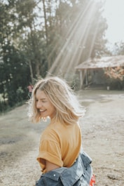 woman walking in white sand during daytime