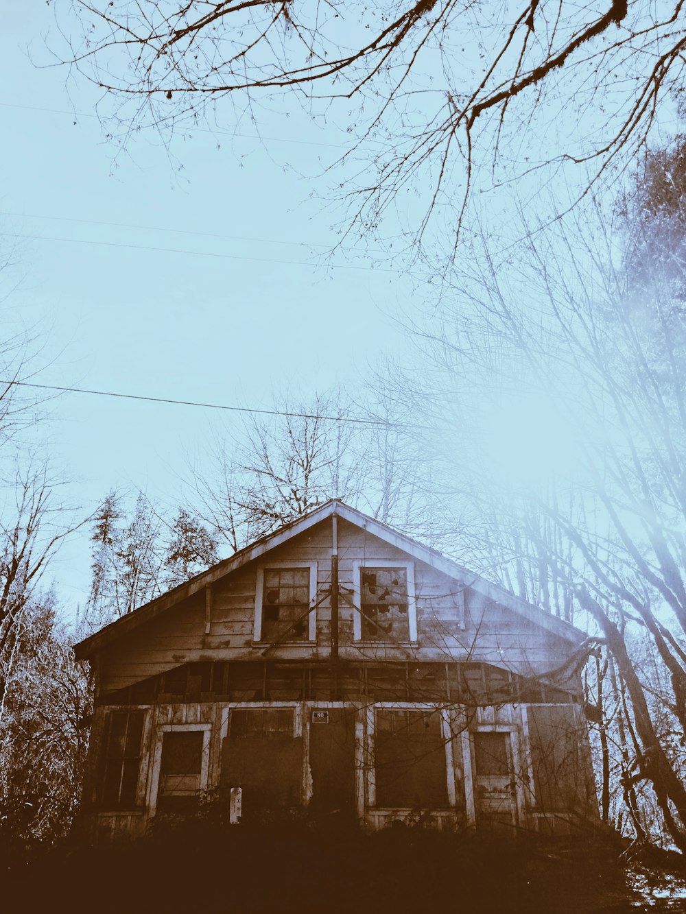 brown wooden house under blue sky during daytime