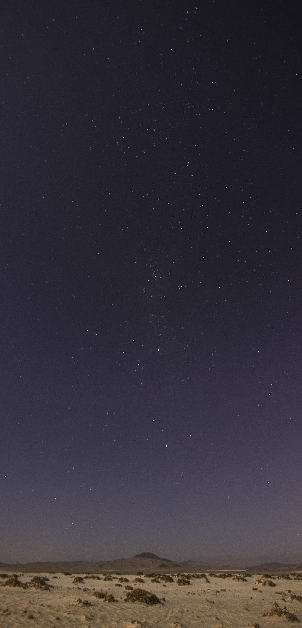 brown pavement under milky way