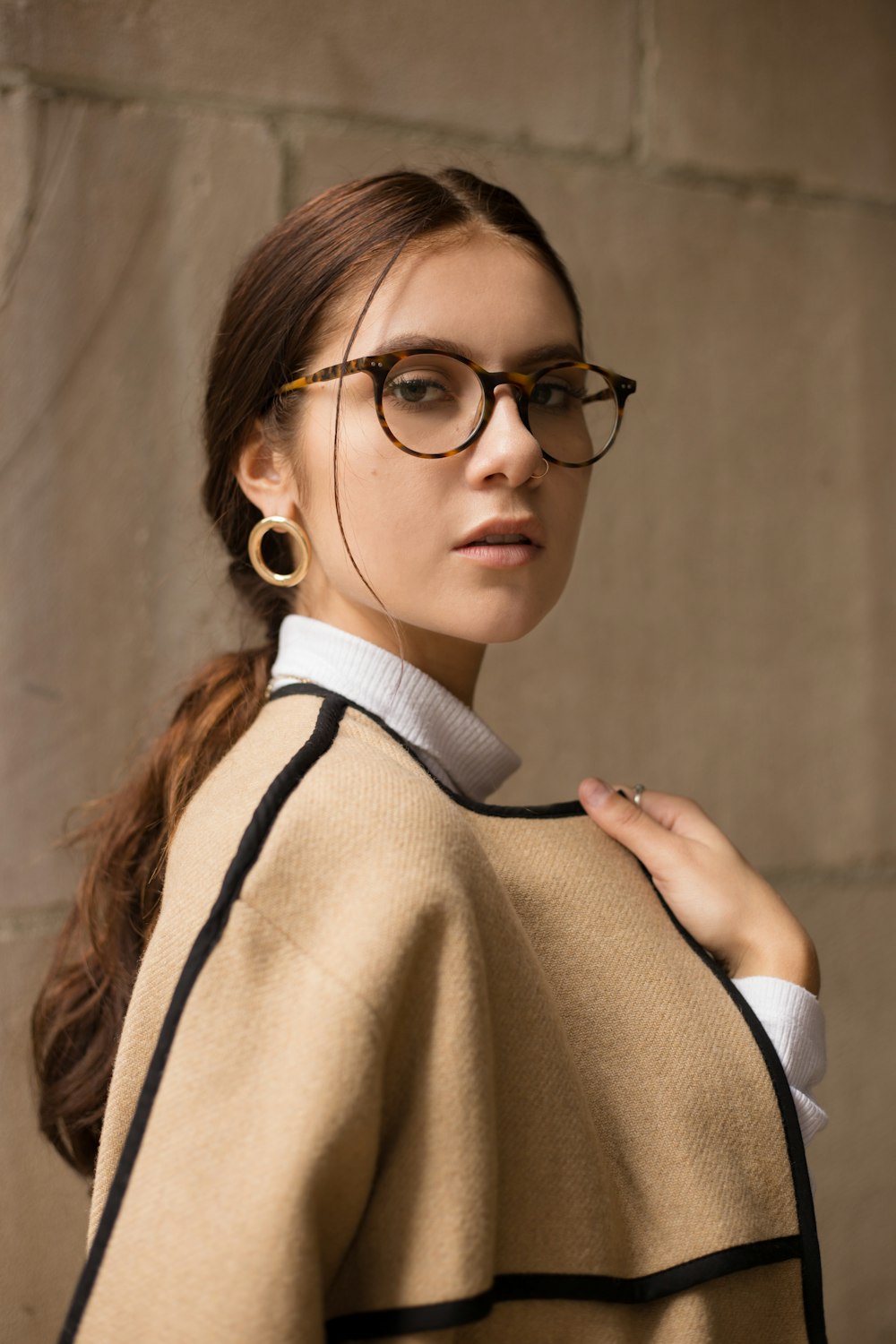 woman wearing brown and black coat