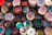 A cozy kitchen scene with stacked colorful ceramic bowls on a wooden table.