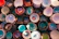 A cozy kitchen scene with stacked colorful ceramic bowls on a wooden table.