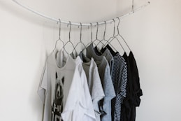 assorted-color clothes hanging on rod