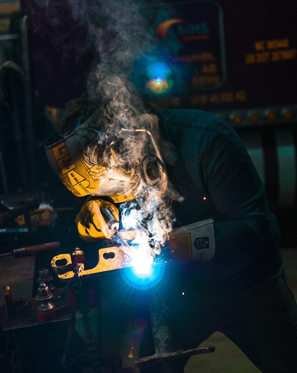 person welding metal tool