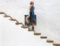 woman climbing on brown concrete stairs