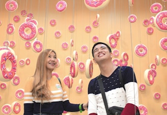 A vibrant donut shop interior with happy customers.