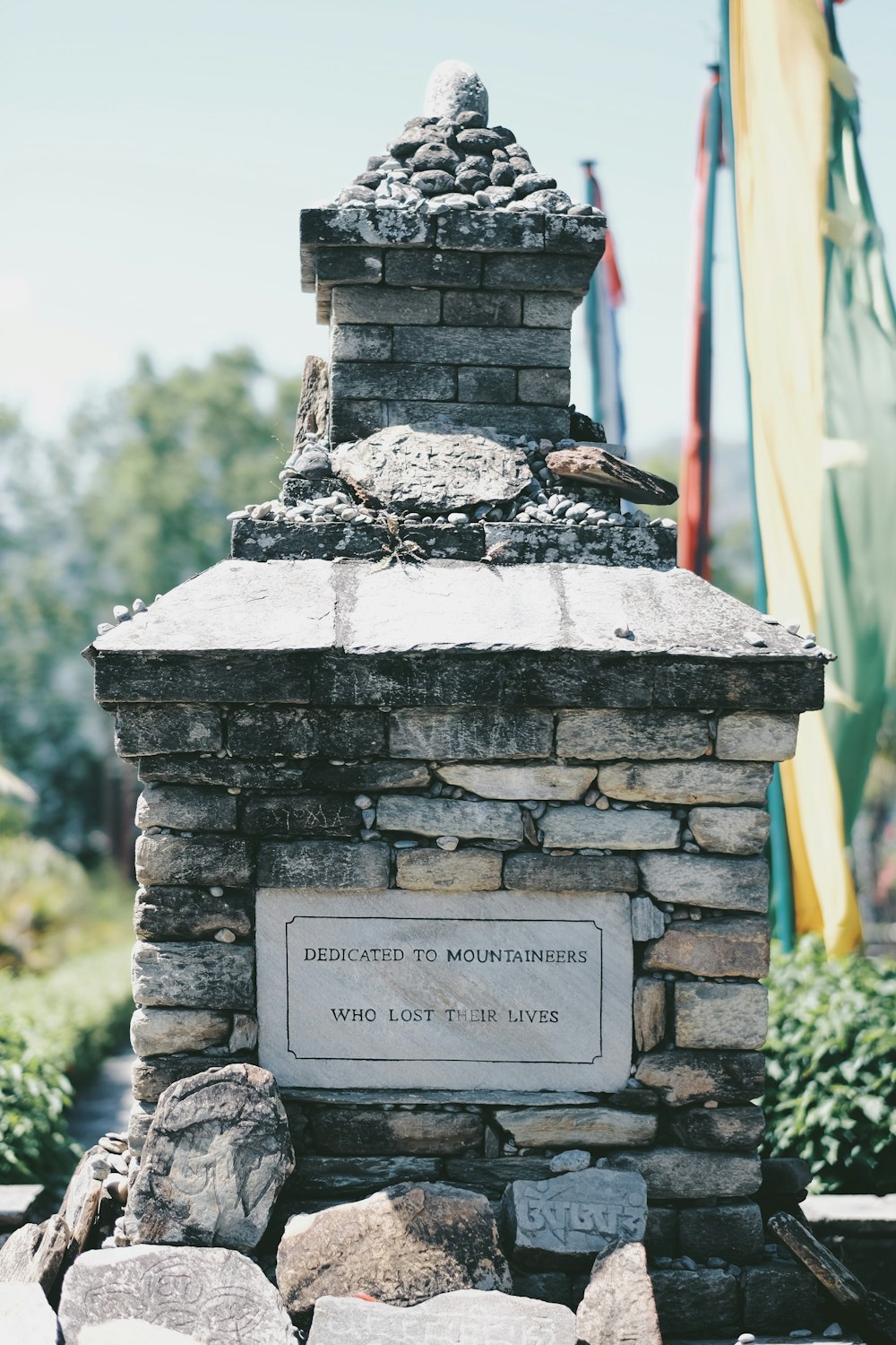 gray concrete dedicated to mountaineers who lost their lives tomb