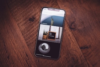 turned on black Android smartphone on brown platform