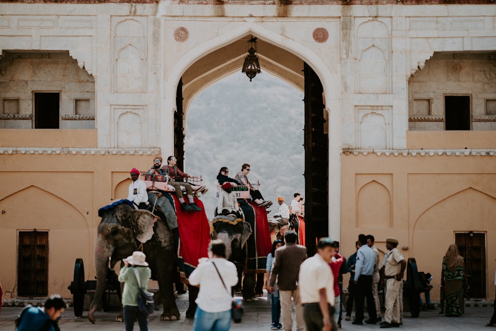 group of people near arch gate