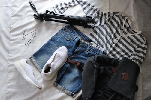 A stylish outfit laid out on a bed, ready for a date.