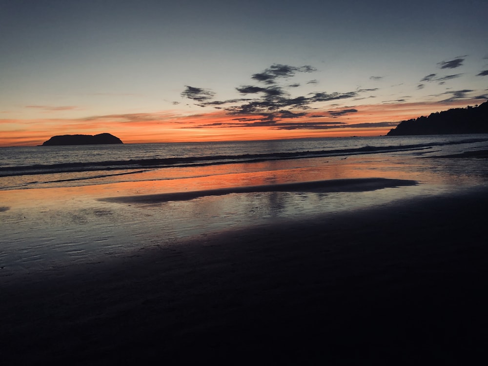 beach shore on horizon of sunset