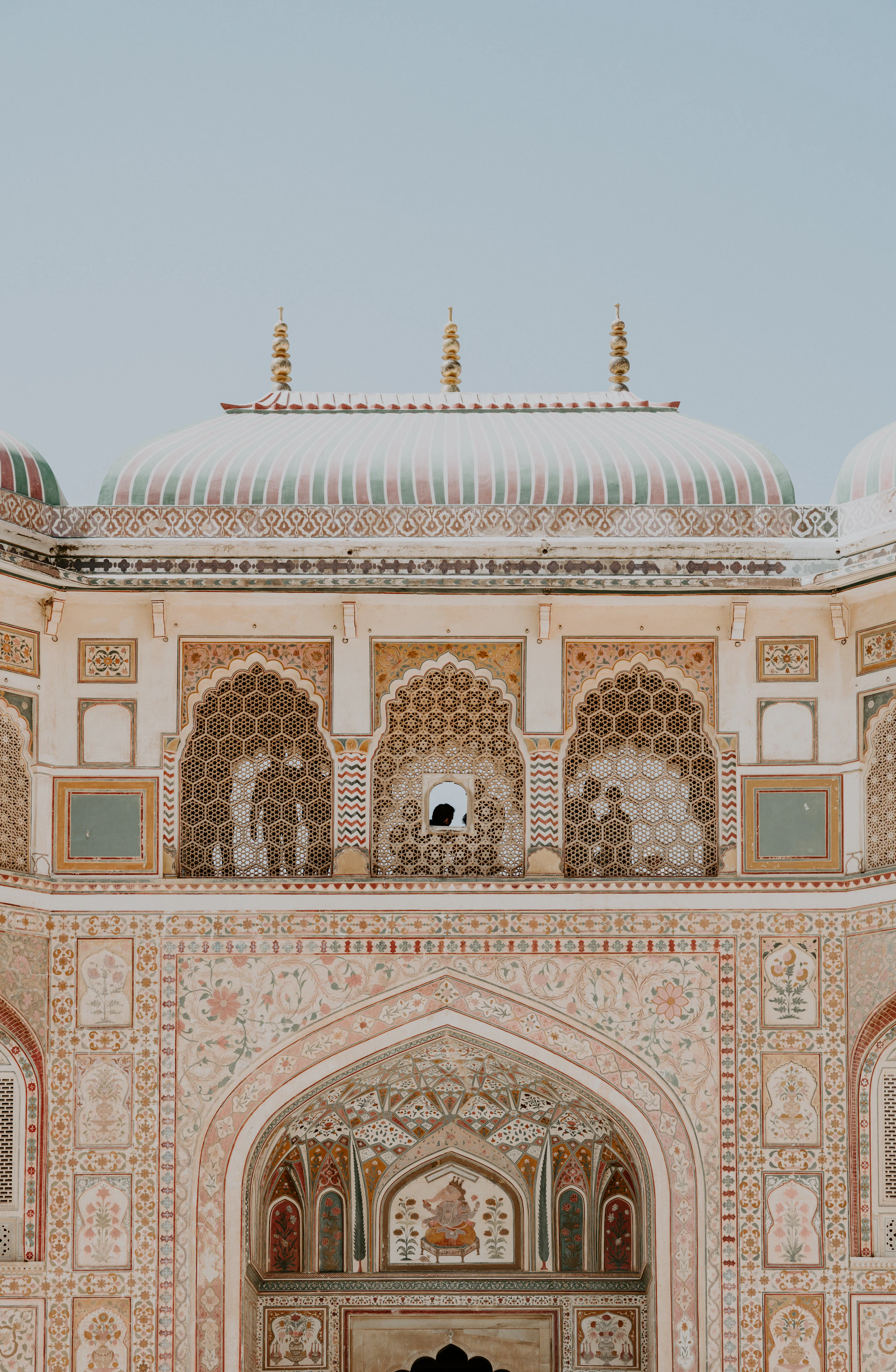 Sunlit heritage Indian palace architecture at golden hour