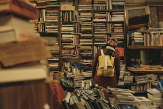 person carrying backpack inside library