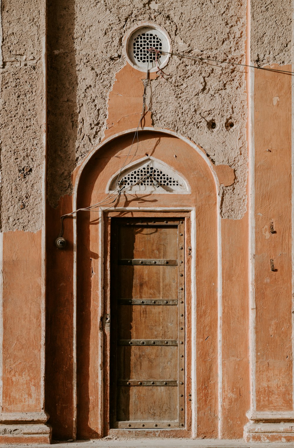 photo of closed brown wooden door