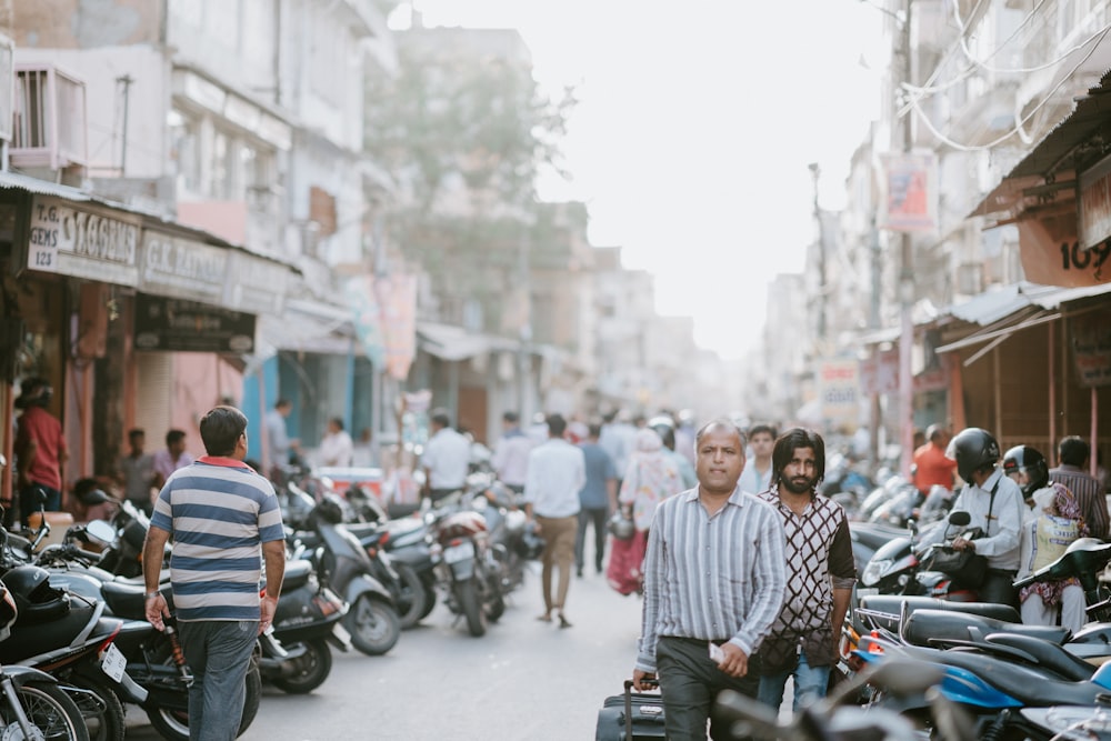 group of people walking on alley