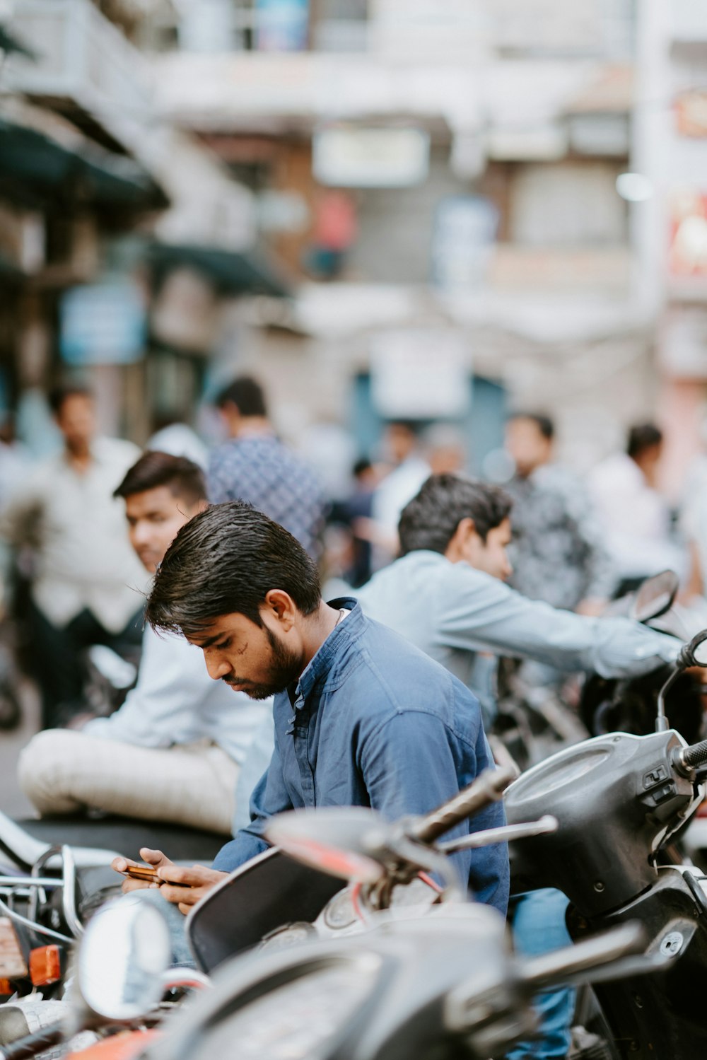 man holding phone during day time