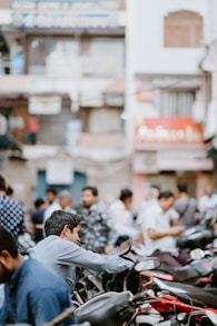 selective focus photo of man riding motorcycle
