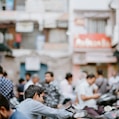 selective focus photo of man riding motorcycle