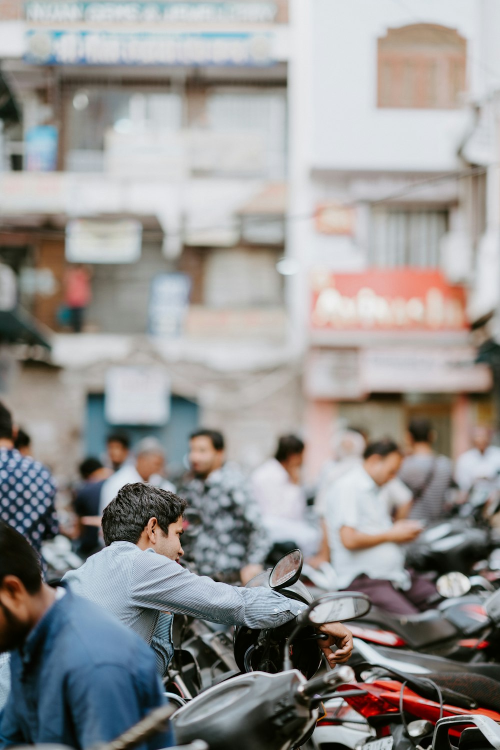 selective focus photo of man riding motorcycle