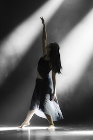 woman raising left hand