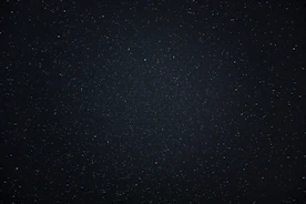 a night sky with a few stars in it