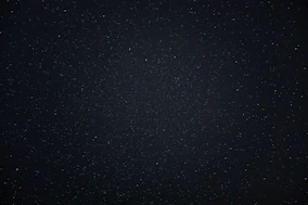 a night sky with a few stars in it