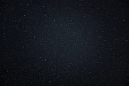 a night sky with a few stars in it