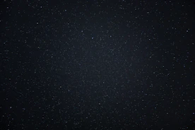 a night sky with a few stars in it