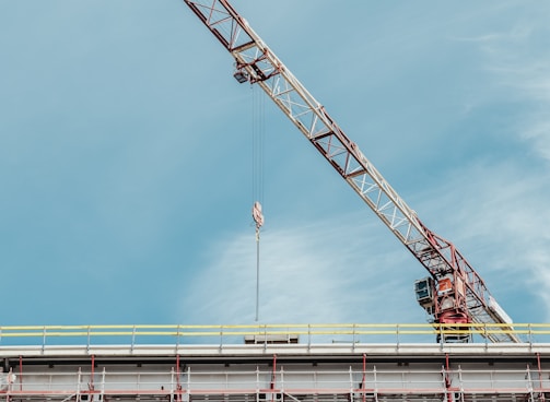 gray and brown crane on top of building