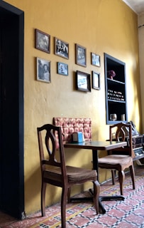 A cozy corner of the room with comfortable chairs and a table.