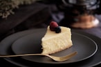 sliced of cake on black plate