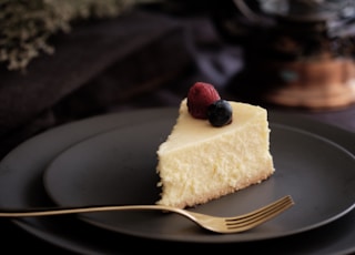 sliced of cake on black plate