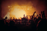 band performing on stage in front of people