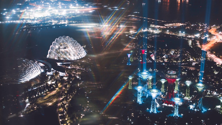 A futuristic cityscape of Amaravati glowing with digital networks and quantum-inspired light patterns.