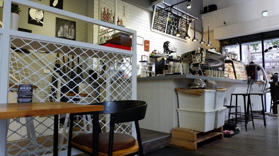 A serene and natural Japandi-style café interior with coffee and pastries.