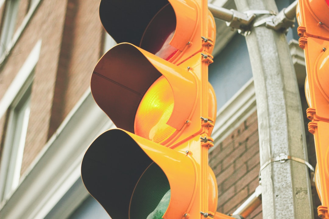 yellow painted traffic light,