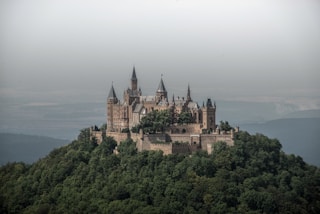 grey and white castle on hills