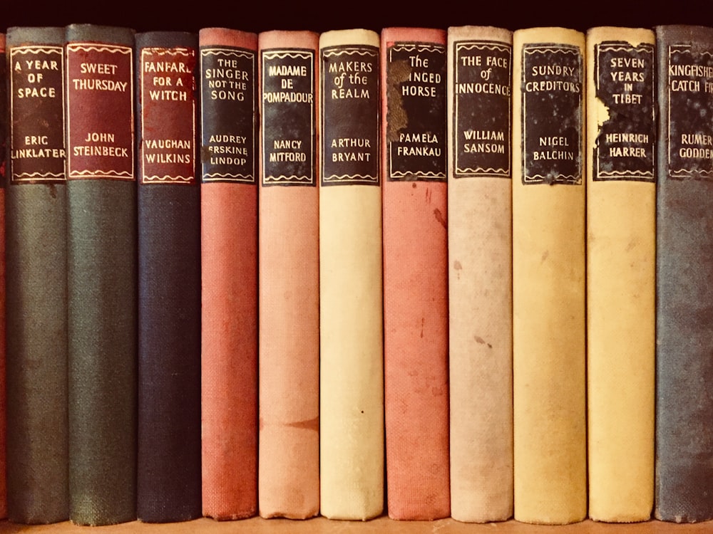 closeup photo of assorted-title books