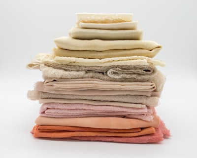 pile of cloth on white surface textile google meet background