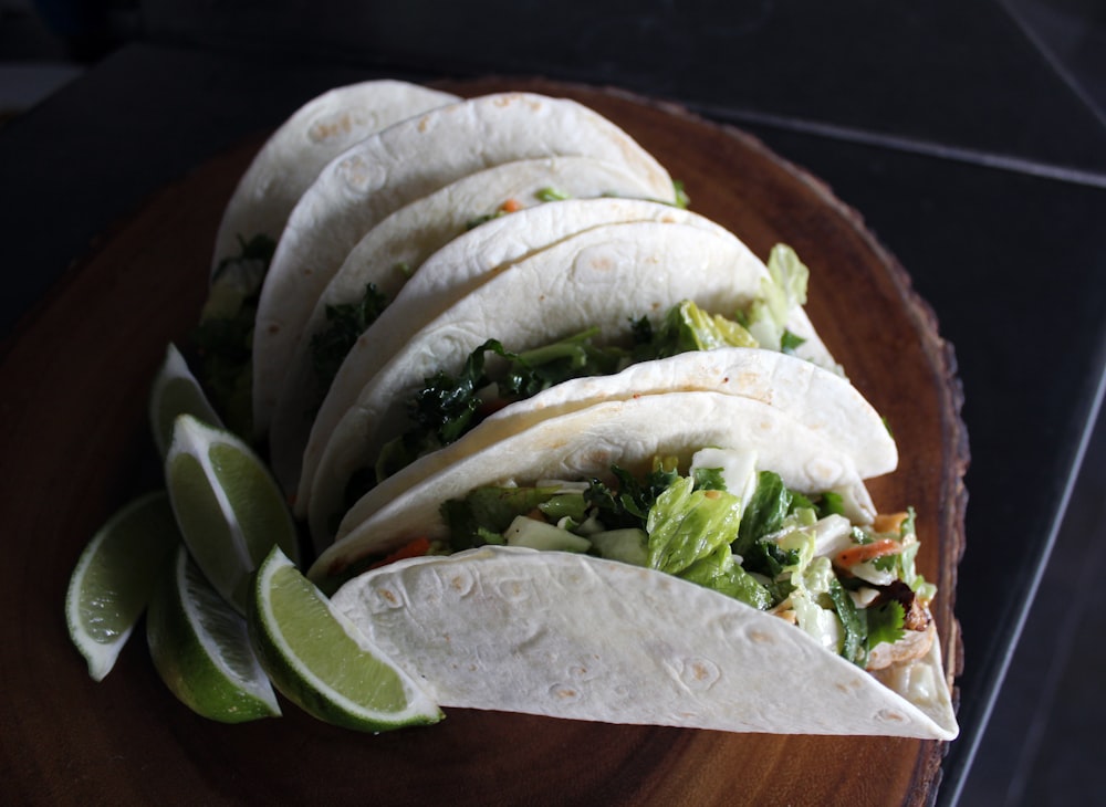 tacos on brown wood slab