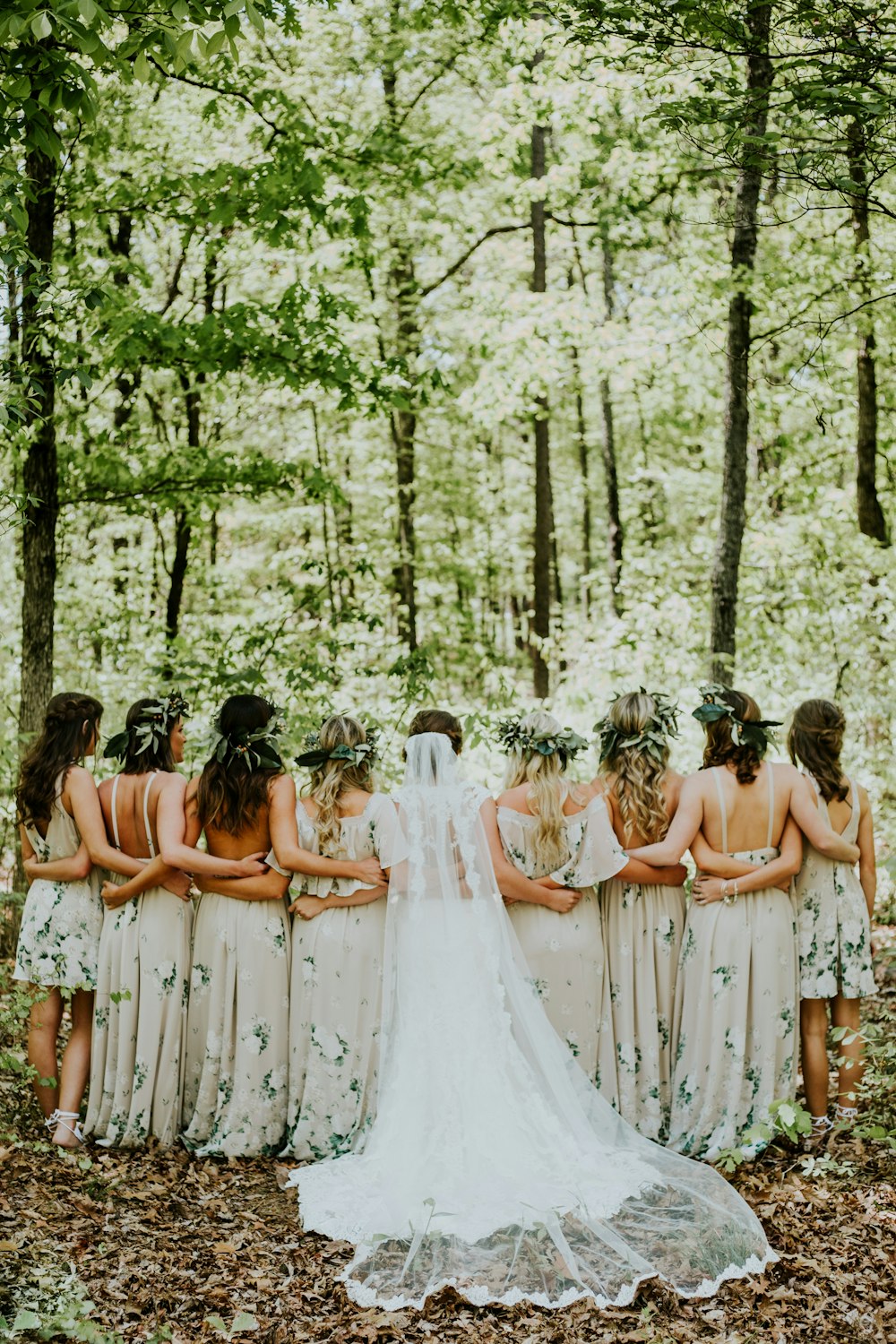 nine women standing at woods